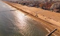 Jesolo in a aerialial panoramic view on blue sea - golden beach and sea with back city